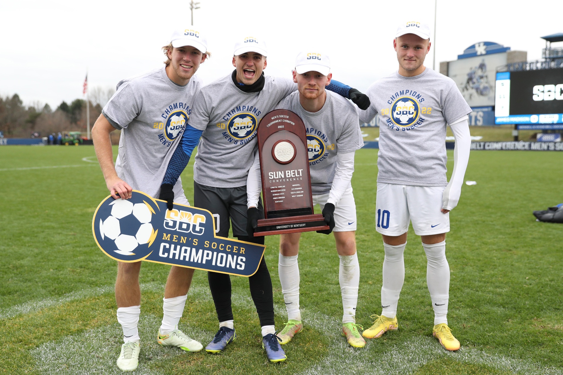 Kentucky soccer SBC Champions celebrating with trophy